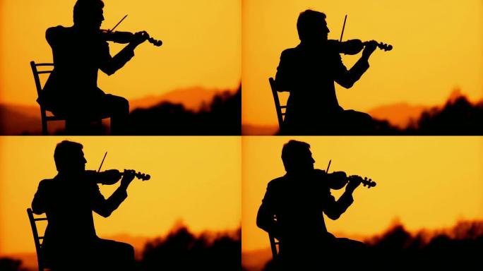 高清: 日落时小提琴手的剪影