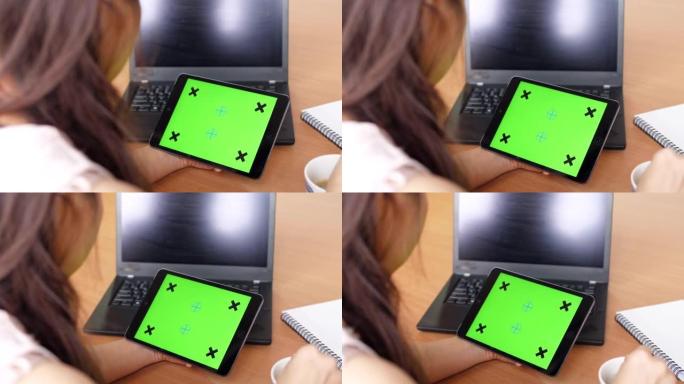 Youngwoman Using digital tablet,Green screen