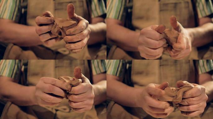 男性手指揉捏棕色粘土的特写视图。