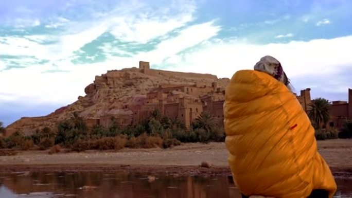 Woman admiring majestic old buildings in Aït Benha