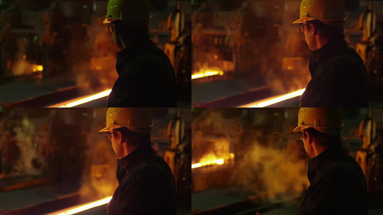 铸造厂戴着安全帽的重工业技术员肖像。工业环境。