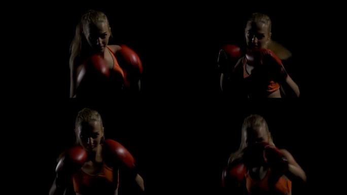年轻的女跆拳道太极拳作为训练格斗的运动。在黑暗中拳击。