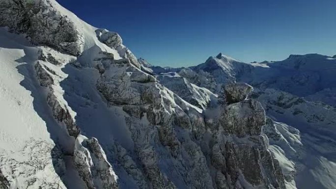 Establishing shot of snowy mountain top landscape 