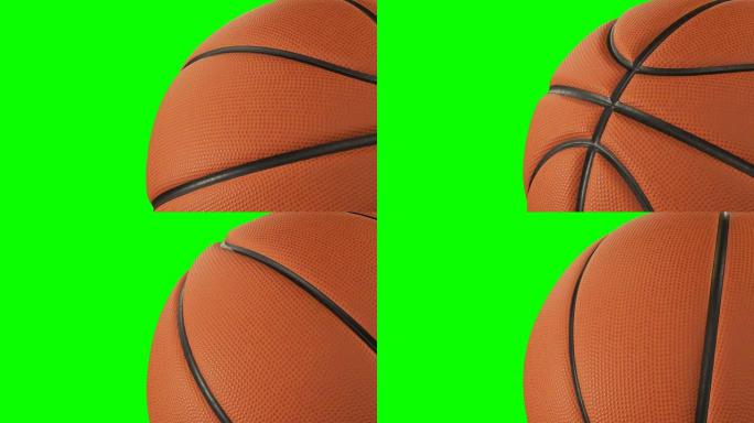 美丽的篮球旋转特写镜头在绿屏上慢动作。回环篮球3d动画的转球。4k超高清3840x2160。