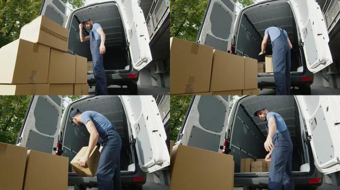 年轻的装载机将箱子放进他的商用车。