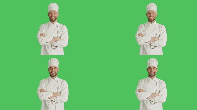 一个英俊的厨师交叉双臂微笑的镜头。背景是绿色屏幕。