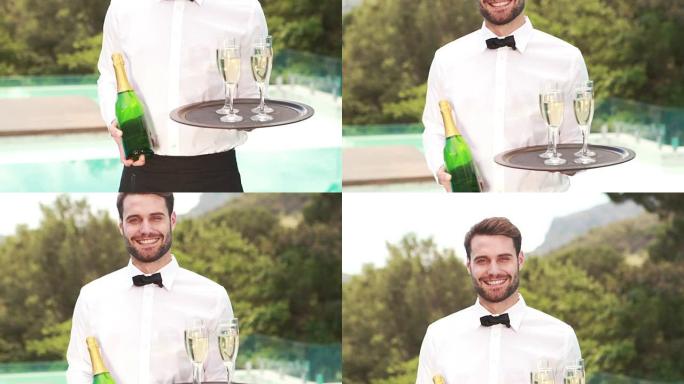 微笑的服务员拿着香槟瓶和长笛