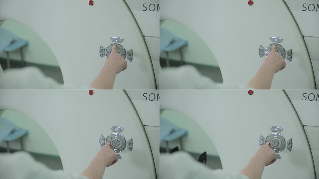 无法识别的医生双手使用计算机断层扫描CT MRI扫描仪进行操作