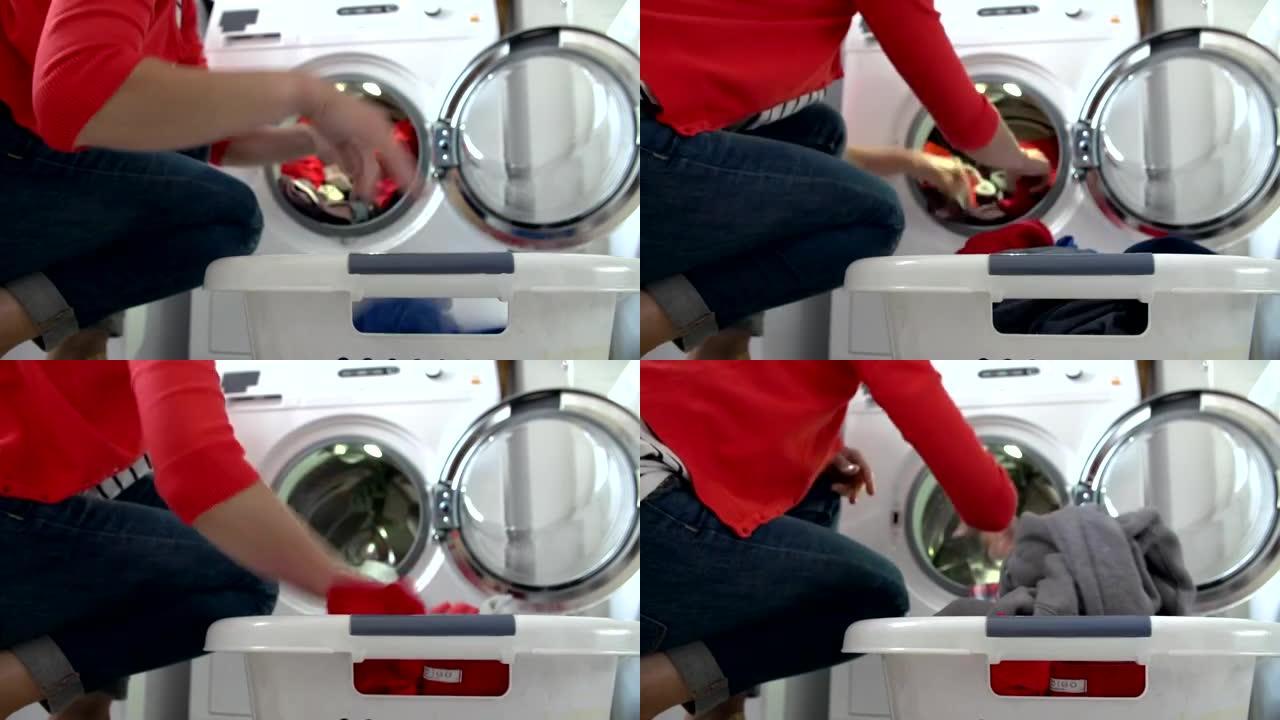 女人从洗衣机里卸下衣服