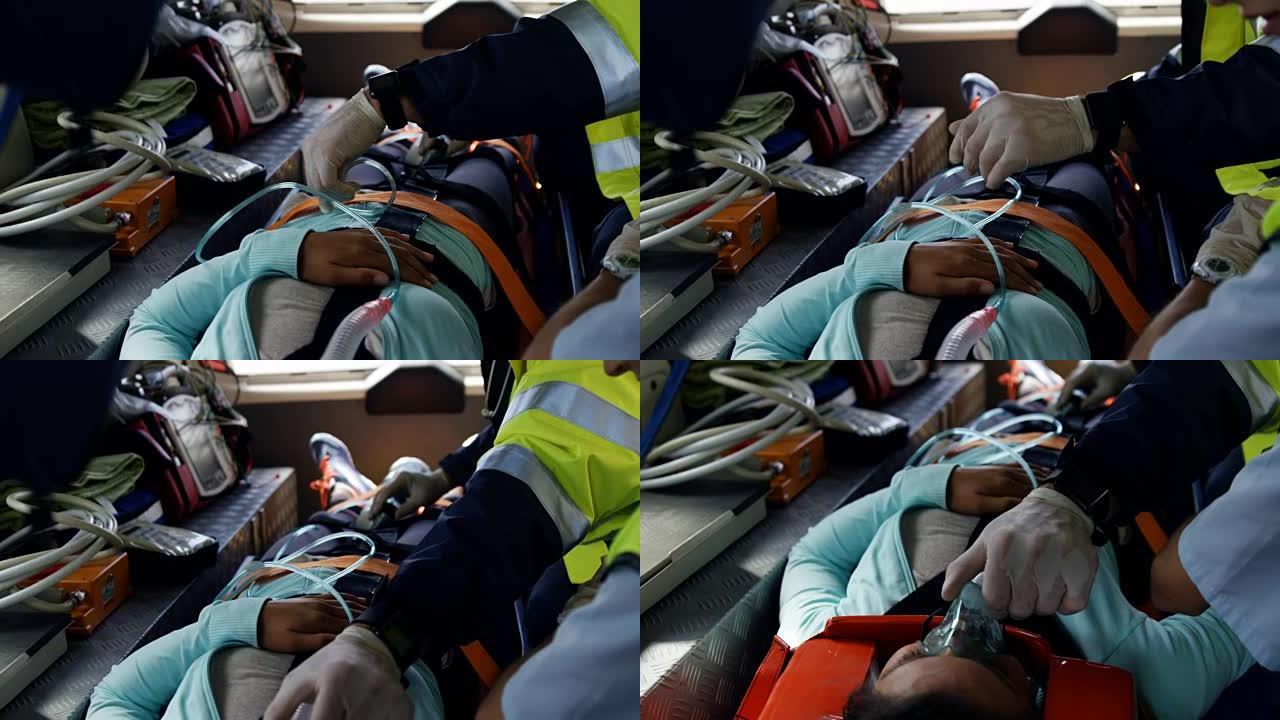 紧急医疗技术人员开车受伤的妇女