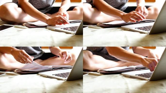 年轻的西班牙裔妇女在床上使用笔记本电脑。绿屏。平移风格。