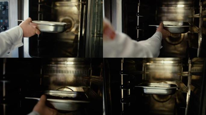 专业厨师把肉放进餐厅厨房的烤箱的特写镜头