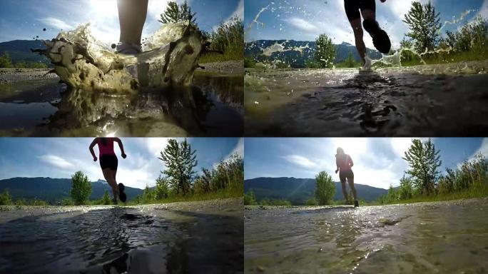健康女性慢跑通过水坑4k的后视图