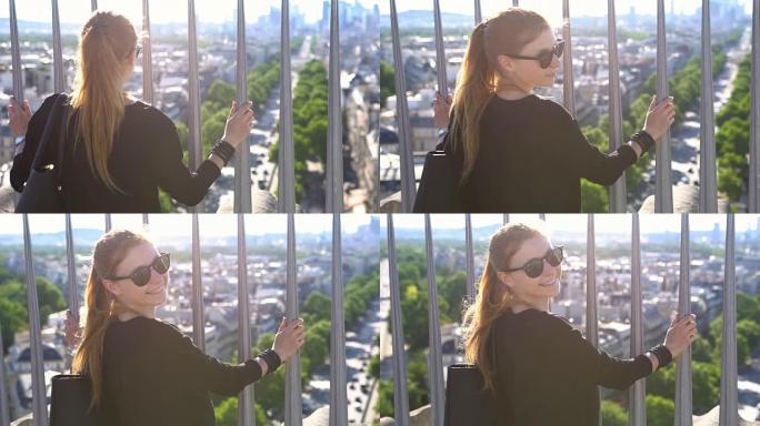 巴黎的女人从凯旋门顶上欣赏风景
