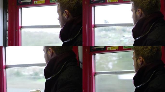 火车上的男子在R3D上喝外卖咖啡