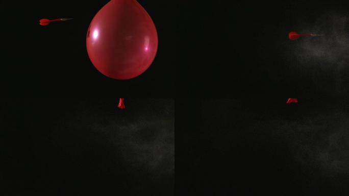 慢动作中的飞镖刺穿红色气球