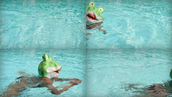 穿着青蛙服装的游泳运动员在屏幕上游泳