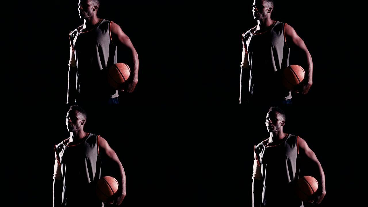 篮球运动员面向左站立，夜间持球
