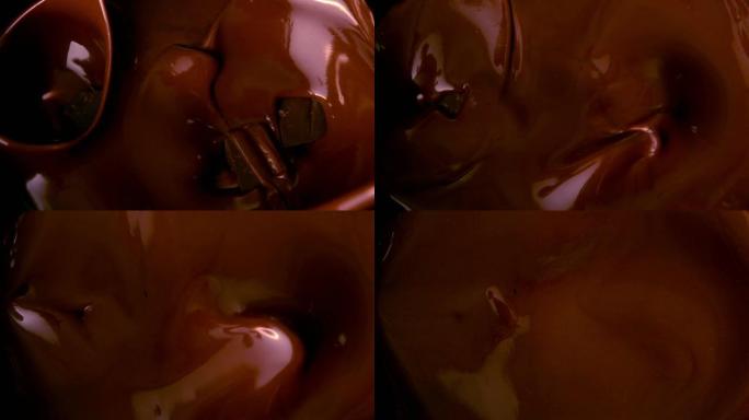 巧克力块掉在融化的巧克力中