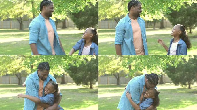 非裔美国人父亲，女儿，高五岁和拥抱