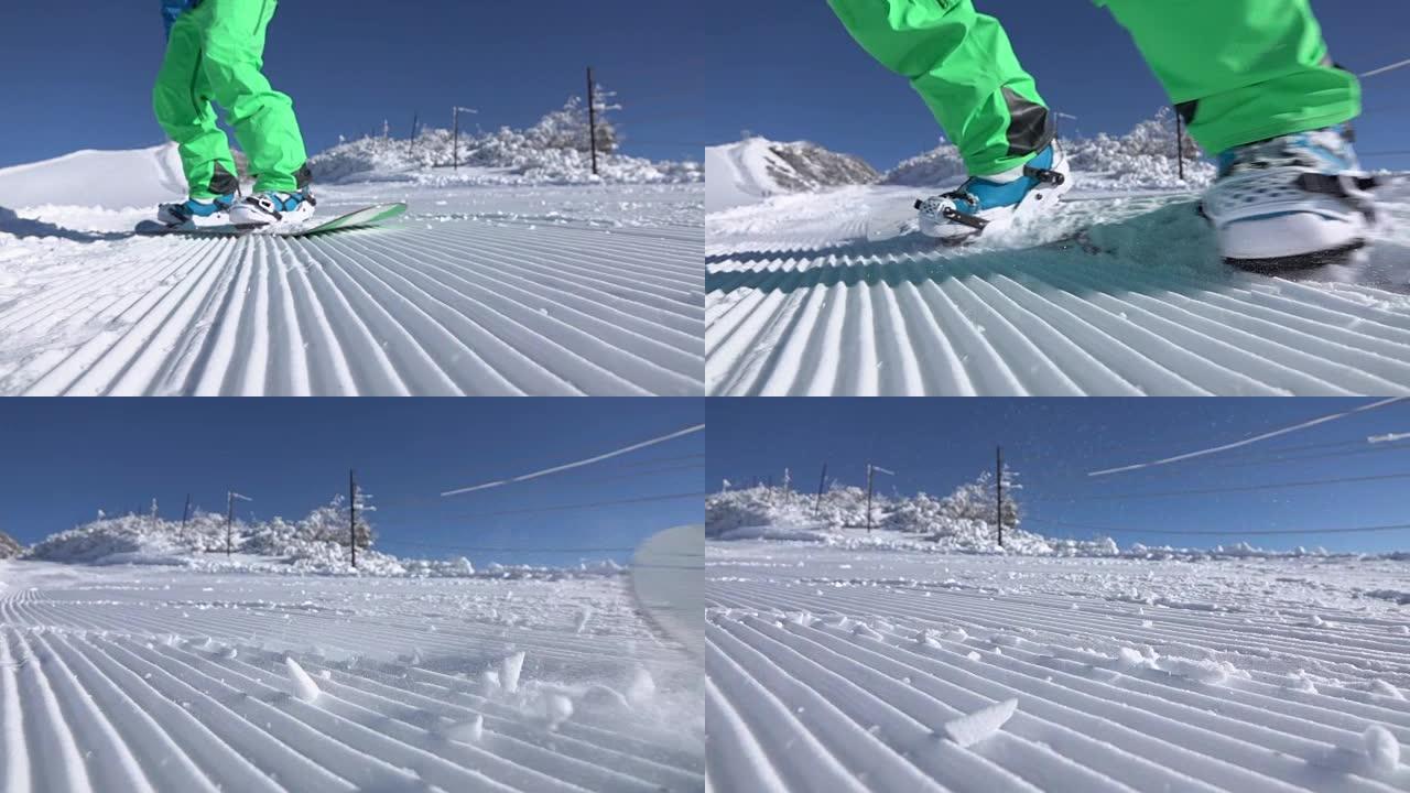 慢动作特写: 在滑雪胜地修饰的雪上雕刻极端滑雪板