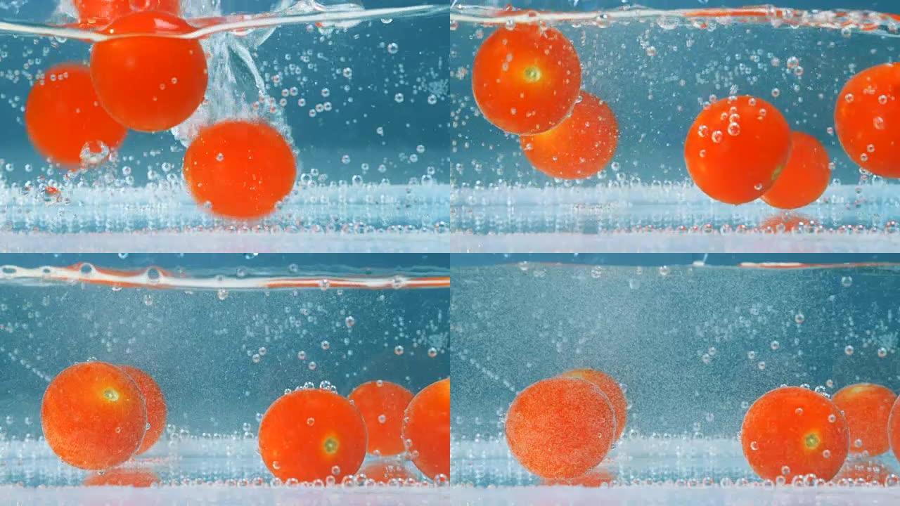 红色西红柿溅在蓝色淡水中。高速相机拍摄。
