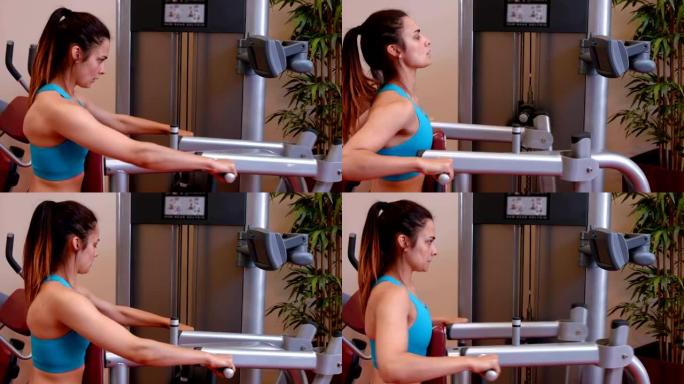 在健身房使用举重机的女人