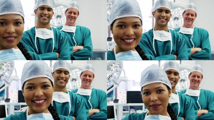 外科医生和护士站在手术室双臂交叉的肖像