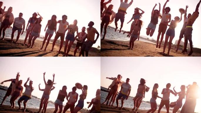 暑假期间，年轻的多民族朋友在海滩上跳跃