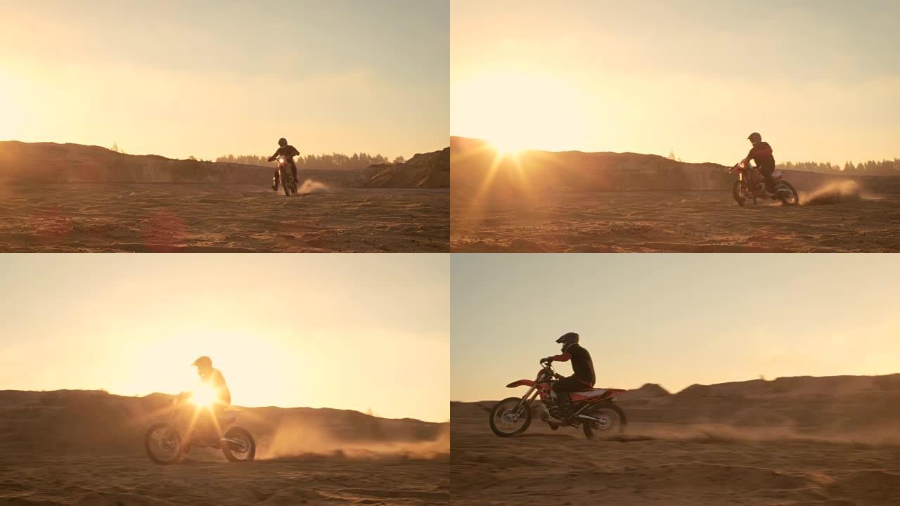 专业的摩托车越野赛车手在越野沙地上驾驶。这是日落和轨道覆盖着烟，雾和朦胧的阳光。