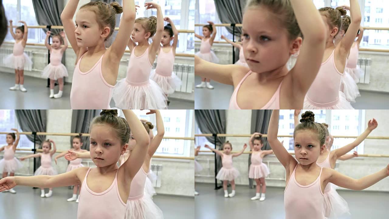 在芭蕾舞课上学习手臂动作