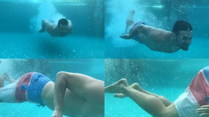 帅哥潜入游泳池游泳的慢动作