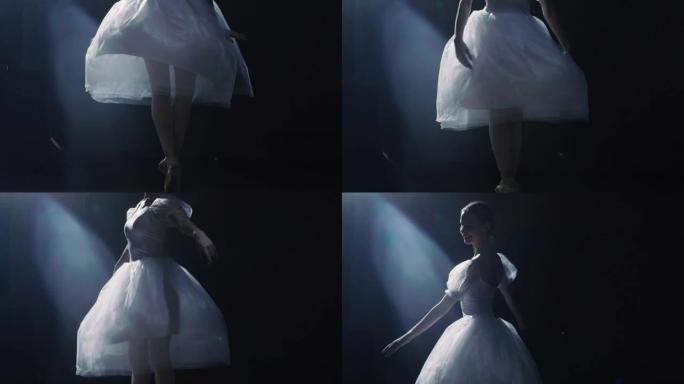 芭蕾舞女演员腿的特写镜头。她在聚光灯下跳舞，穿着尖头芭蕾舞鞋旋转，周围黑暗。她穿着白色短裙。慢动作。