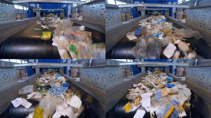 垃圾回收厂的垃圾分类输送机。