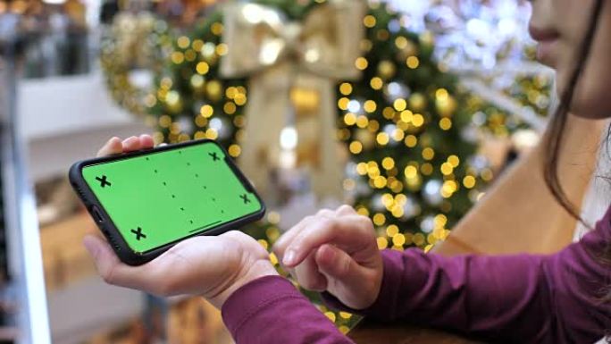 在购物中心使用智能手机绿屏，水平