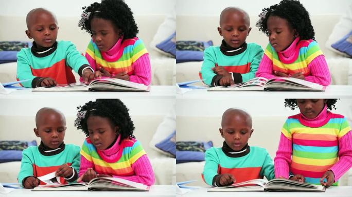 小女孩和男孩在看书