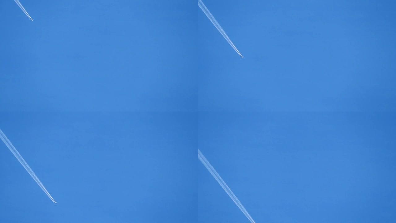 飞机在蓝天上制造蒸气痕迹