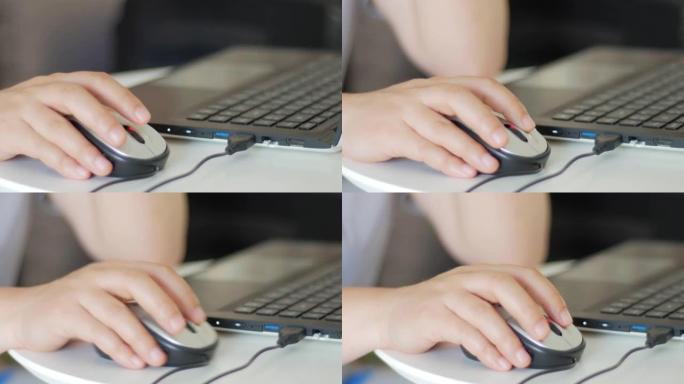 女人的手在笔记本电脑键盘上使用和打字