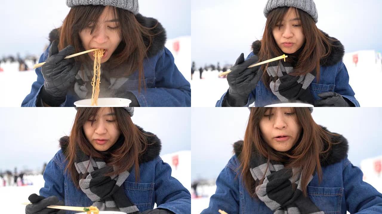 亚洲女人在雪冬吃速溶拉面