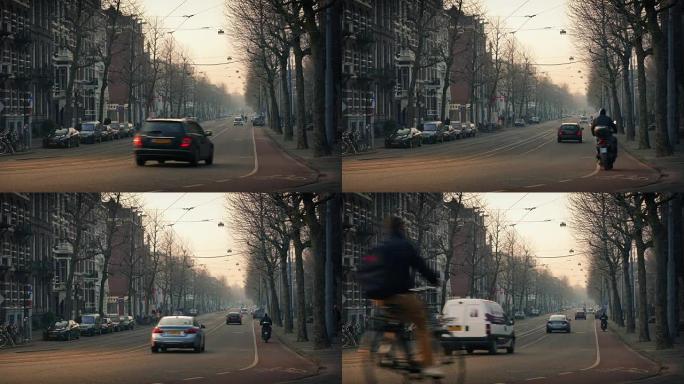 日落时城市中的汽车和自行车