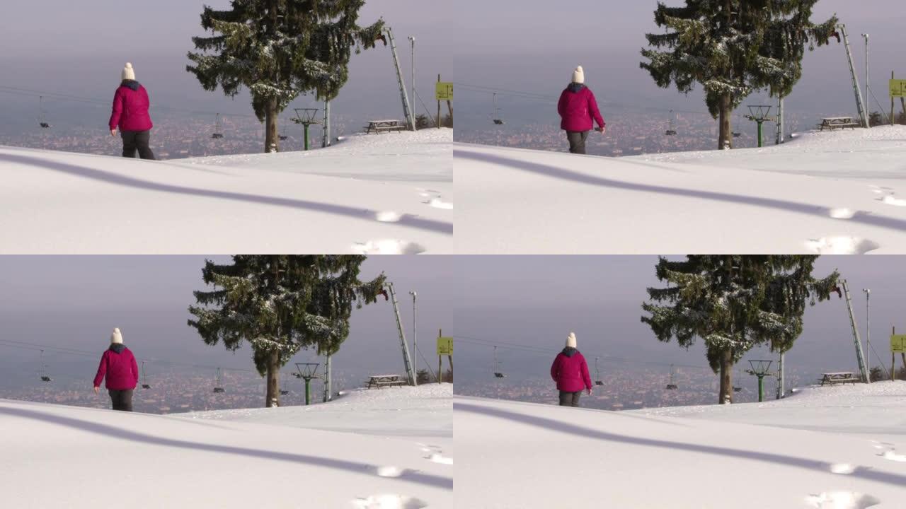 4k女孩在阳光明媚的滑雪坡上雪地行走，慢动作