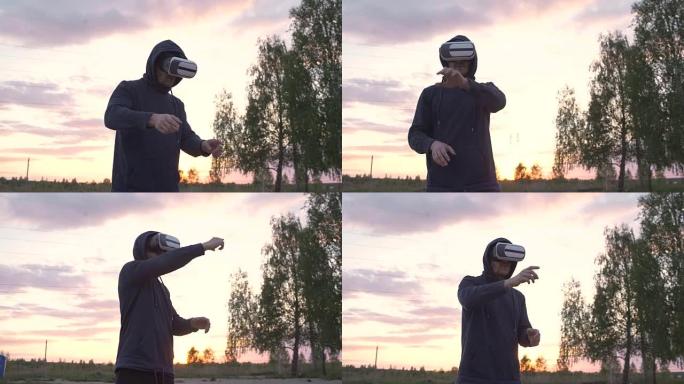 年轻人使用VR 360耳机，并在日落时在城市公园体验现实
