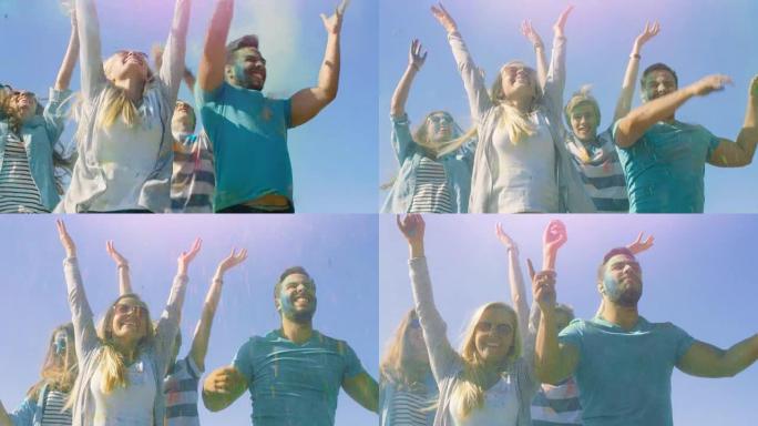 为了庆祝胡里节，多民族的年轻人在空中跳跃并投掷五颜六色的粉末。在这个阳光明媚的日子里，他们玩得很开心