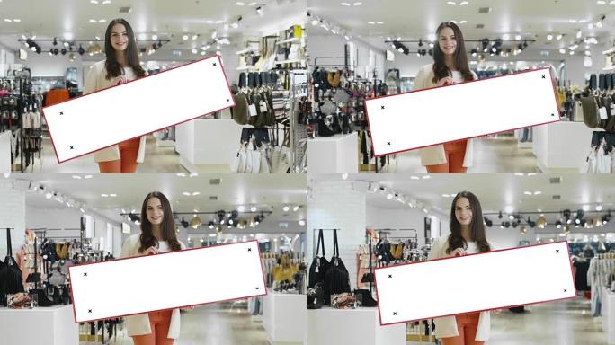 年轻微笑的黑发女子在一家百货商店里举着一个空白的模拟牌子。