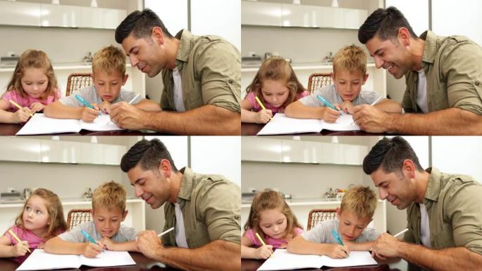 孩子们和爸爸在餐桌旁画画
