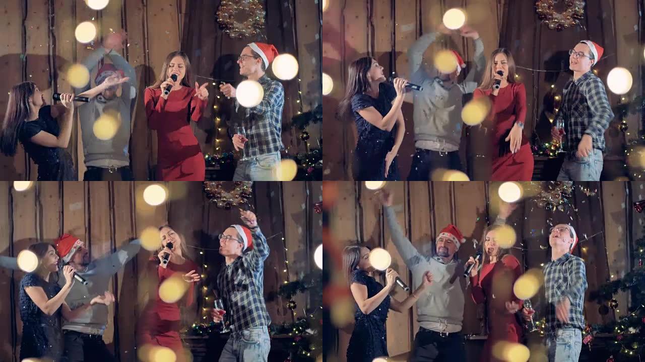 欢乐一群朋友跳舞唱歌庆祝圣诞节新年派对。