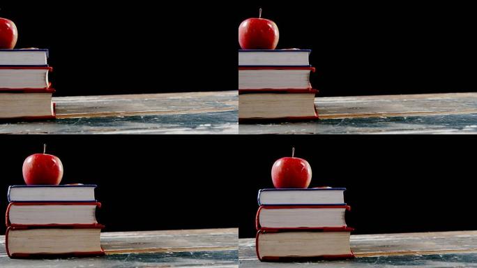 书堆上的红苹果