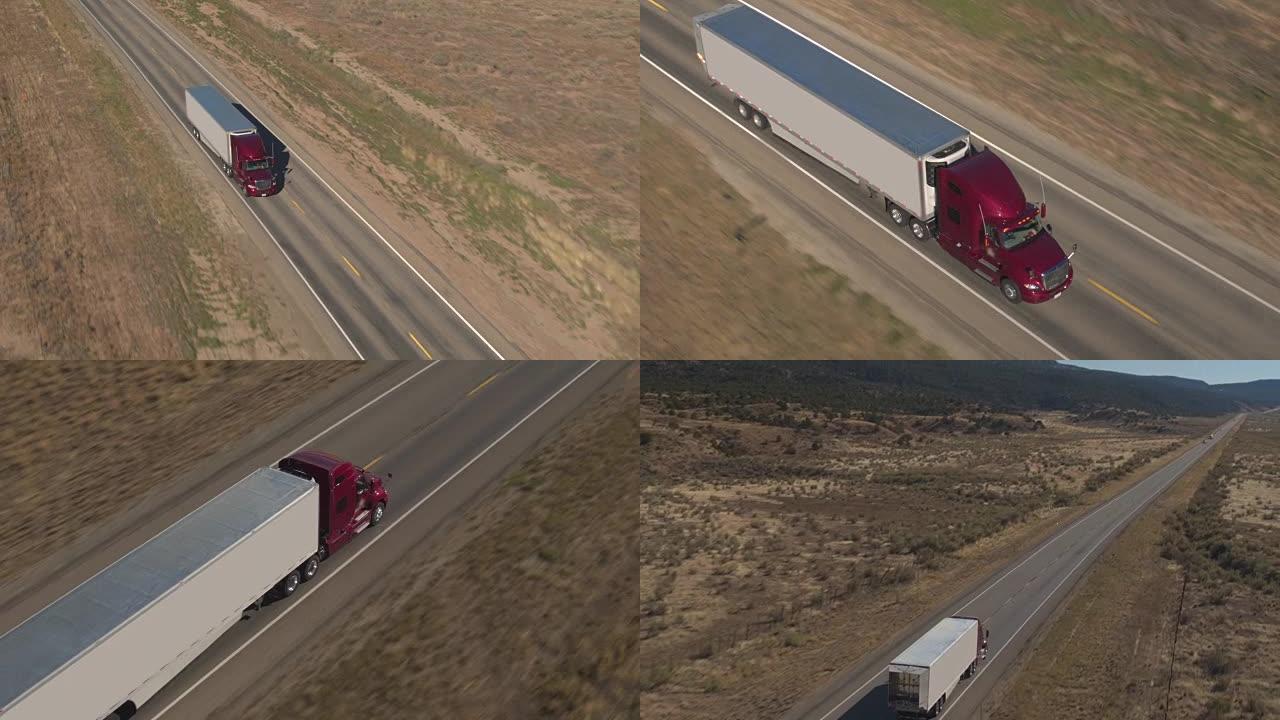 空中特写: 集装箱半卡车沿着沙漠中的空旷高速公路行驶