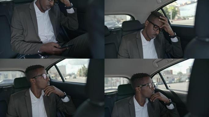 非洲商人在乘车期间在智能手机上上网