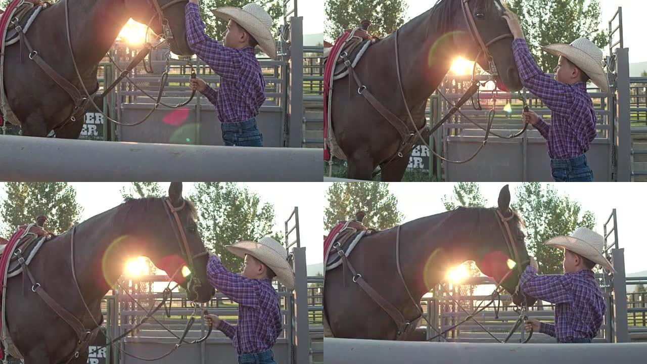 实时视频，年轻的牛仔站着，抚摸着他的马的头，抚慰他的马
